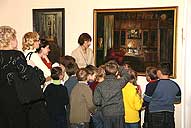 Chief of the Fine Art Department I.F. Zhdanova telling the children about the pictures of G. Chistyakova-Gorevaya